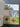 Collection of vintage postcards on a grid-patterned surface